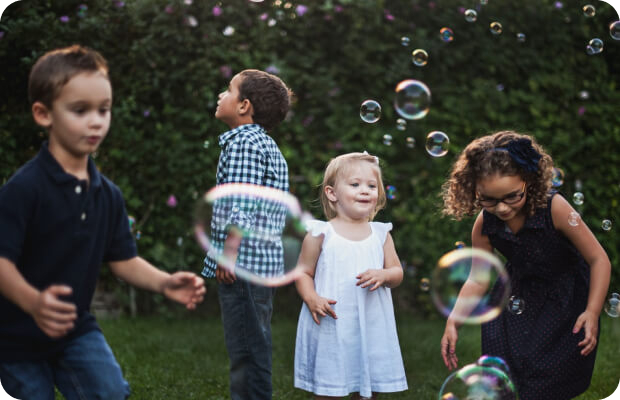 Children playing with bubbles