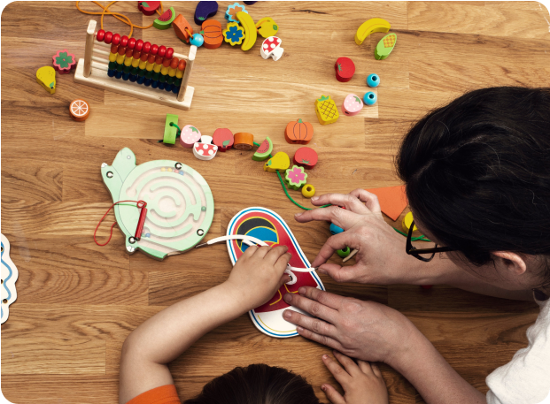 A practitioner works with a child on skills development