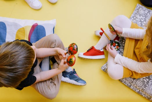 Joyful children playing maracas in a colorful preschool setting.